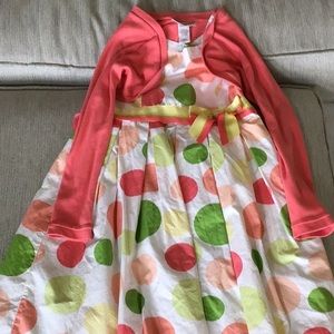 Girls cute white, pink and green polka dot dress and sweater.